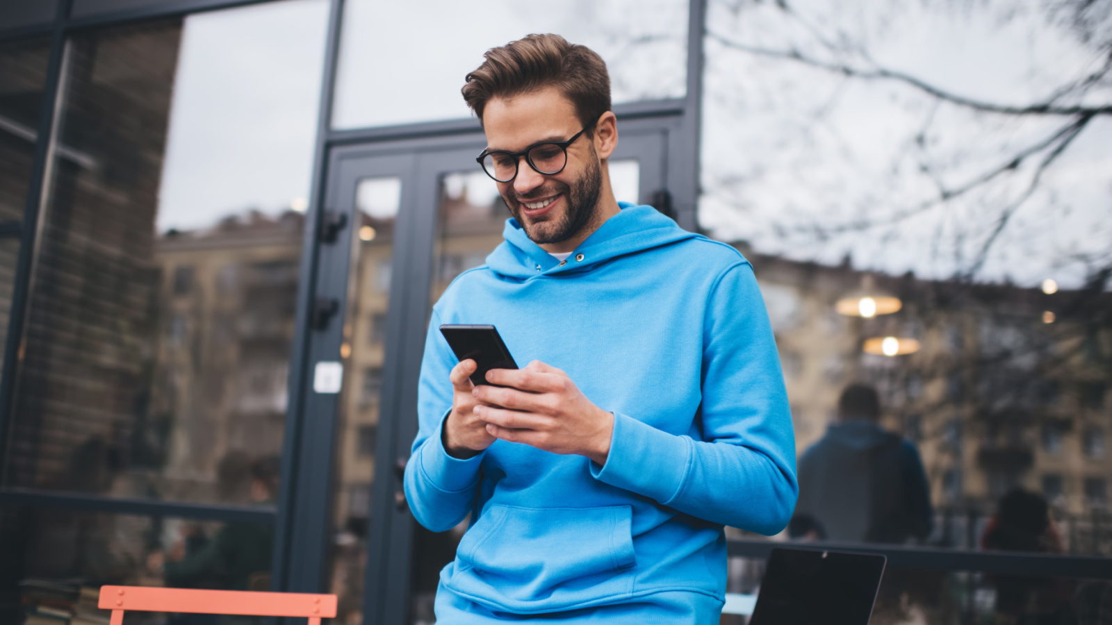 Happy hipster social media phone coffee GaudiLab Shutterstock Happy hipster social media phone coffee GaudiLab Shutterstock