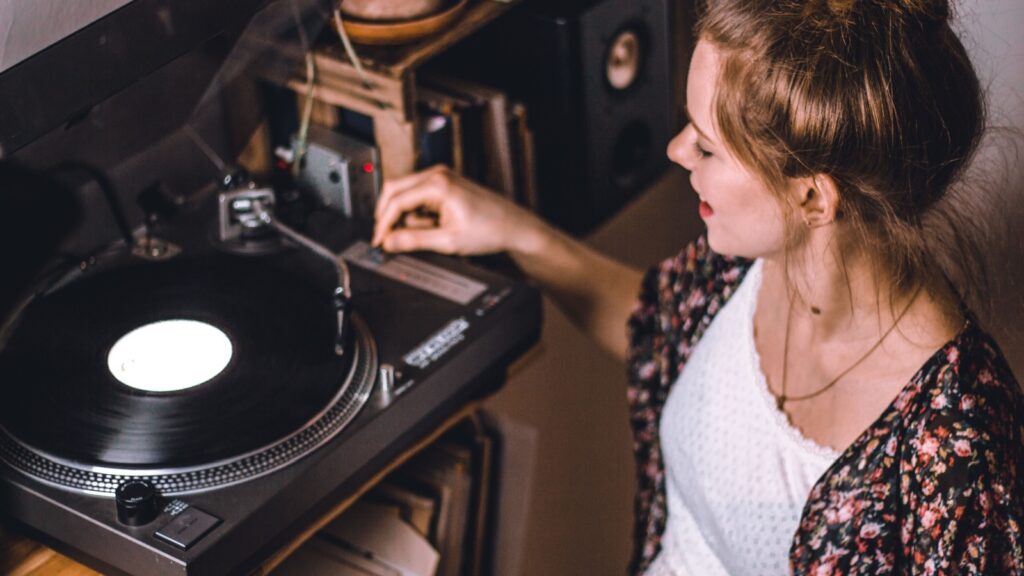Woman Listening to Turntable Records Vinyl Music Alexander Grumeth Shutterstock